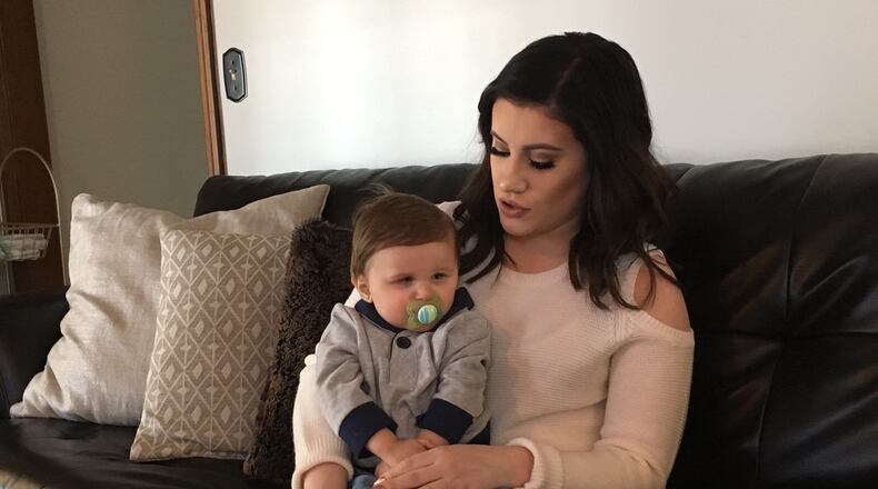 Miami Township resident Abigail Martin holds her son Aston, 22-months, whose medication to treat potentially deadly seizures was $180,000 for an eight-week treatment. KATIE WEDELL/STAFF