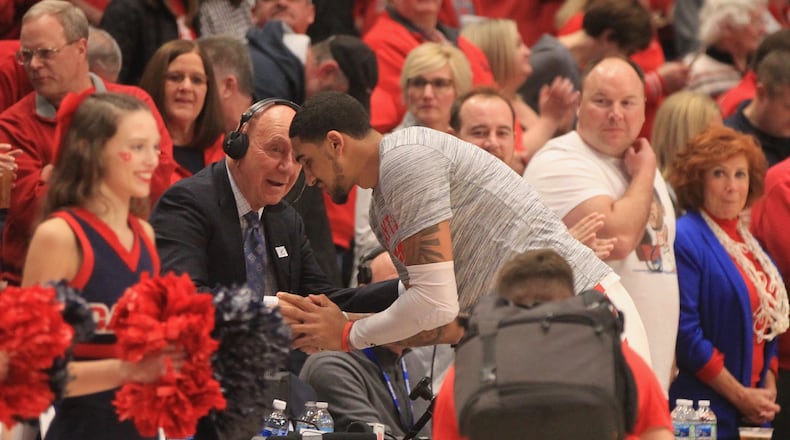 Former Dayton Flyers player Obi Toppin shakes hands with Dick Vitale before a game against Davidson on Friday, Feb. 28, 2020, at UD Arena. DAVID JABLONSKI / STAFF