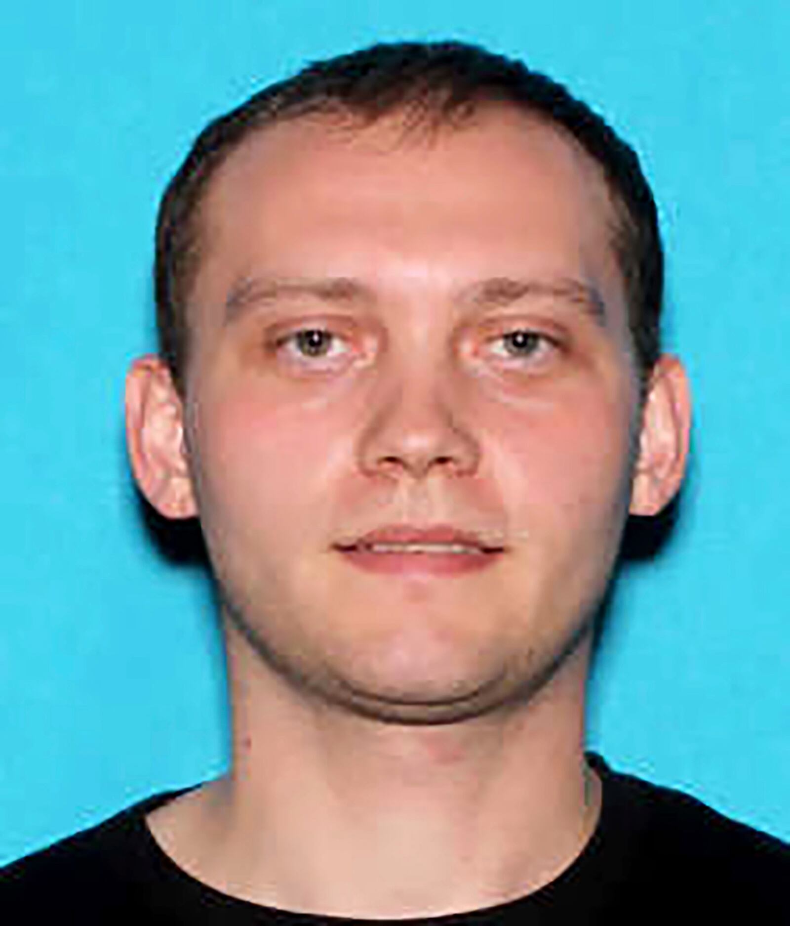 This driver's license photo provided by the Wayne Police Department shows Brian Anthony Browning, who was shot and killed, Sunday, June 22, 2025 by security staff at CrossPointe Community Church after authorities say he opened fire outside the church. (Wayne Police Department via AP)