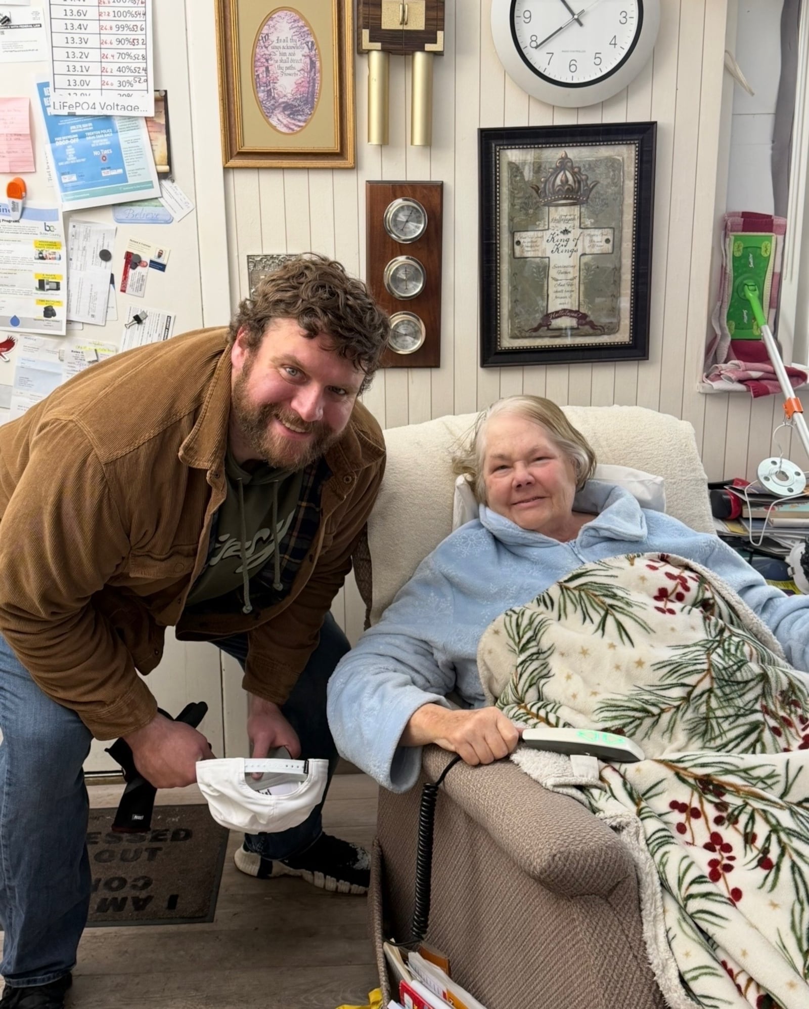 Cincinnati Bengals lineman Ted Karras visits with Aggie Craycraft in her Trenton home after Karras and other volunteers built a wheelchair ramp. SUBMITTED PHOTO