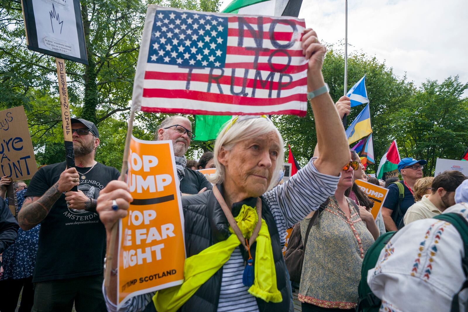 People take part in a Stop Trump Scotland protest outside the US Consulate in Edinburgh, as US President Donald Trump begins his five-day private trip to the country at his Turnberry golf course in South Ayrshire on Saturday July 26, 2025. ( Jane Barlow /PA via AP)