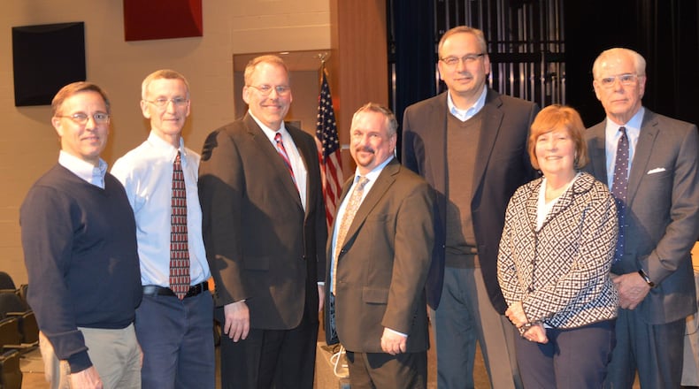 Ed Theroux, center, poses with Talawanda district officials following the board meeting Monday when he was formally hired to be the next superintendent. Pictured are, from lef, board members Chris Otto, Patrick Meade, Michael Crowder, Theroux, Mark Butterfield and Mary Jane Roberts and District Treasurer and CFO Mike Davis. CONTRIBUTED/BOB RATTERMAN