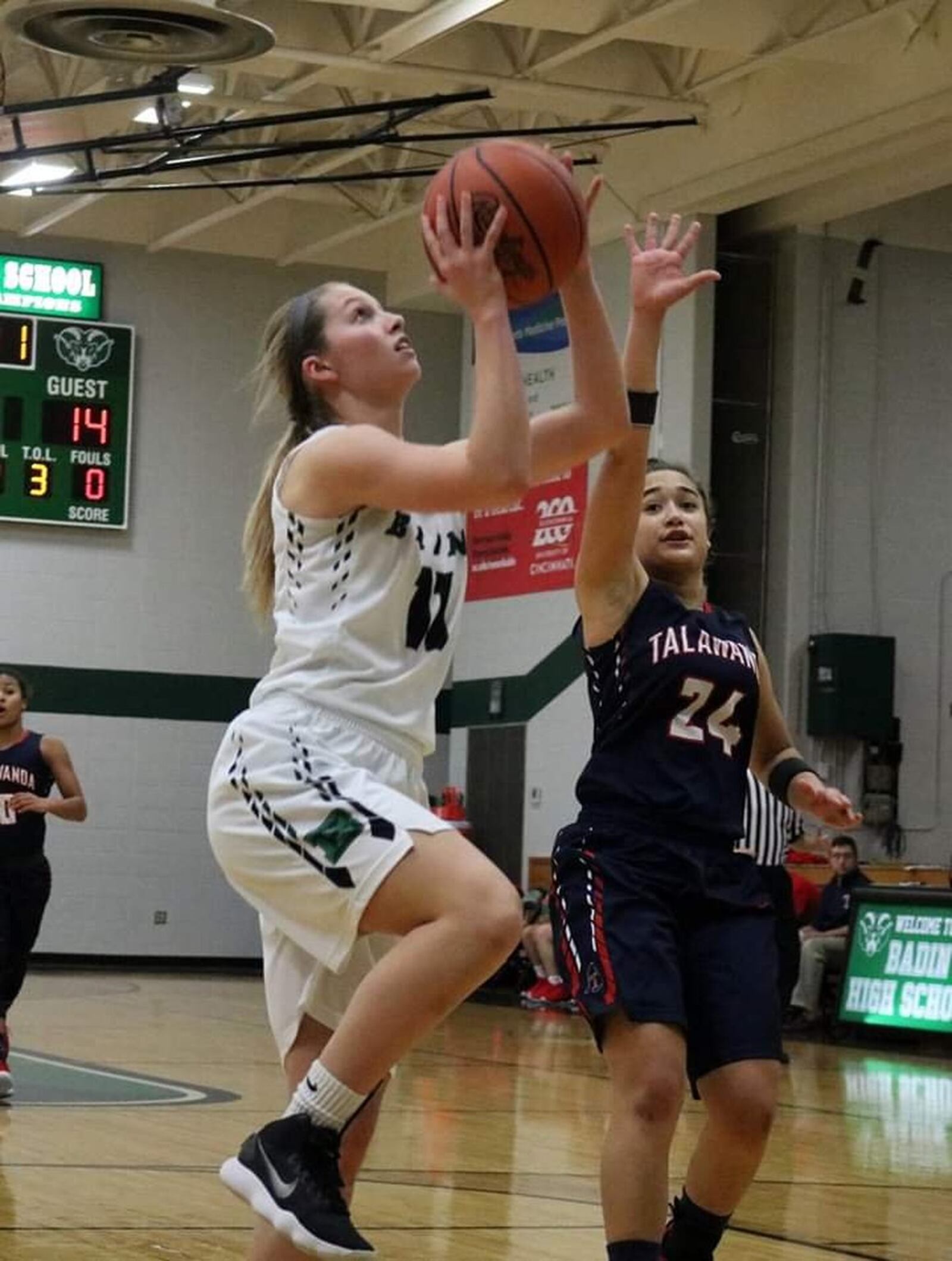 Badin’s Emily Maher (11) gets past Jazz Bennett (24) of Talawanda during Wednesday night’s game at Mulcahey Gym in Hamilton. Badin posted a 79-36 victory. CONTRIBUTED PHOTO BY TERRI ADAMS
