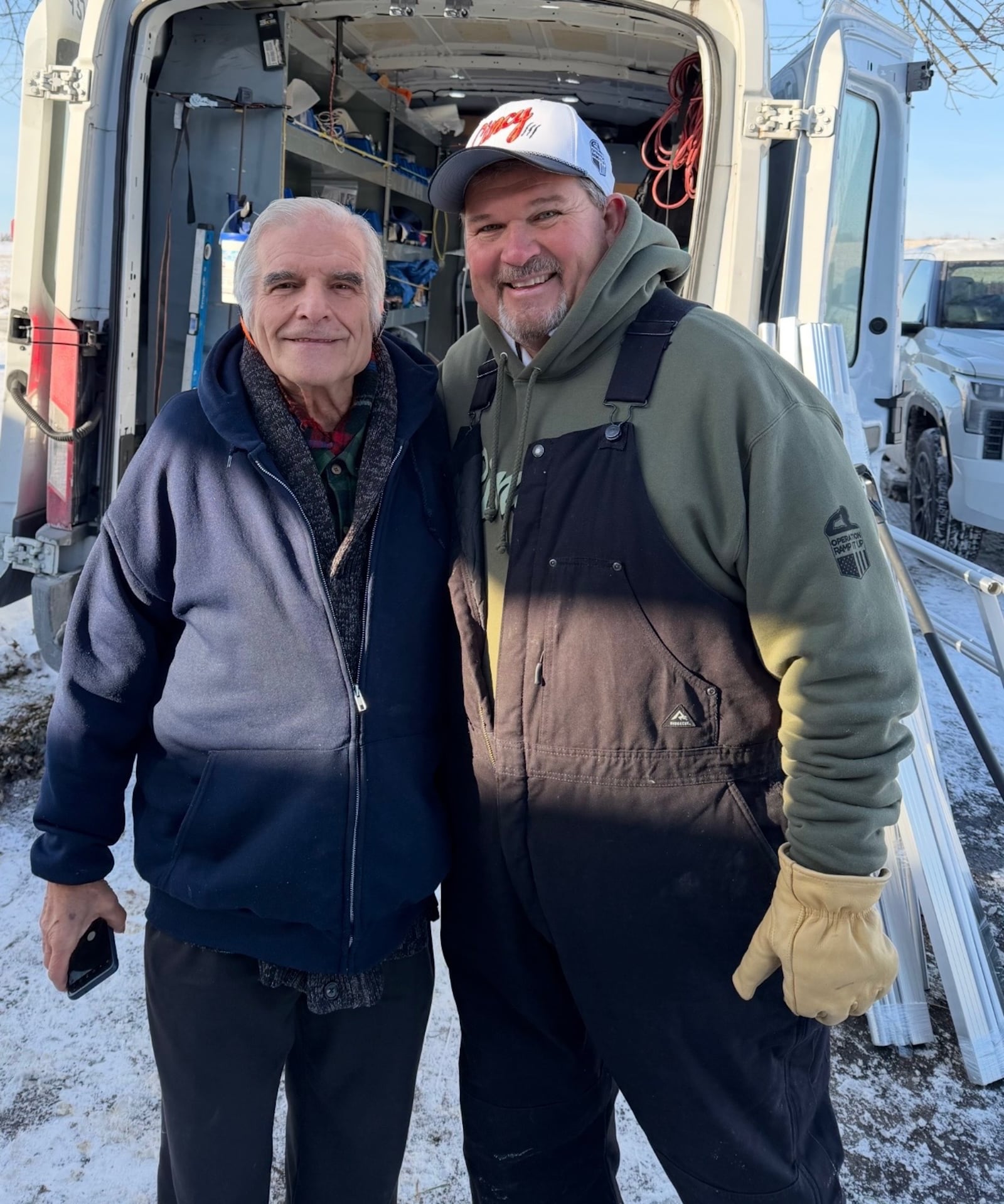 Terry Craycraft, left, a Vietnam veteran, says a ramp built by volunteers, including Greg Schneider, founder of Operation Ramp It Up, makes getting his wife out of the house easier. SUBMITTED PHOTO