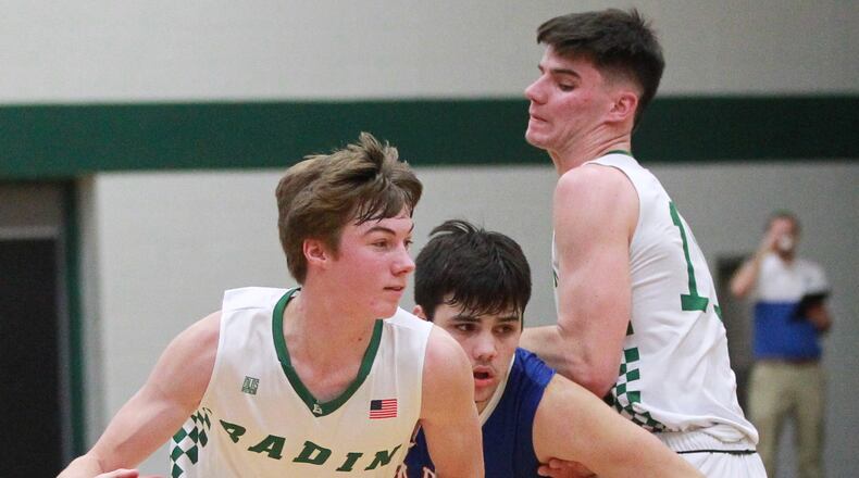 Josh Hegemann of Badin (with ball) uses a screen from teammate Spencer Giesting (right) to get past Sam Severt of Carroll. Badin defeated visiting Carroll 65-52 in a GCL Co-Ed boys high school basketball game on Friday, Dec. 20, 2019. MARC PENDLETON / STAFF