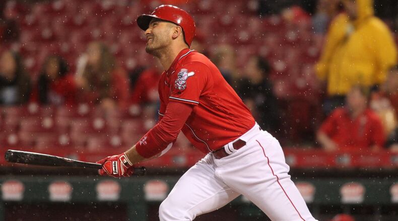 The Reds’ Joey Votto drives in a run with a sacrifice fly against the Giants on Friday, May 5, 2017, at Great American Ball Park in Cincinnati. David Jablonski/Staff
