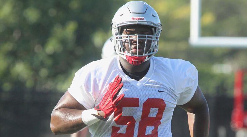 Ohio State defensive lineman Joshua Alabi warms up during the first practice for Ohio State freshmen on Sunday, Aug. 7, 2016, at the Woody Hayes Athletic Center in Columbus. David Jablonski/Staff