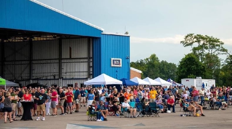 People attend "Hops in the Hangar", a beer event at the Middletown Regional Airport. CONTRIBUTED