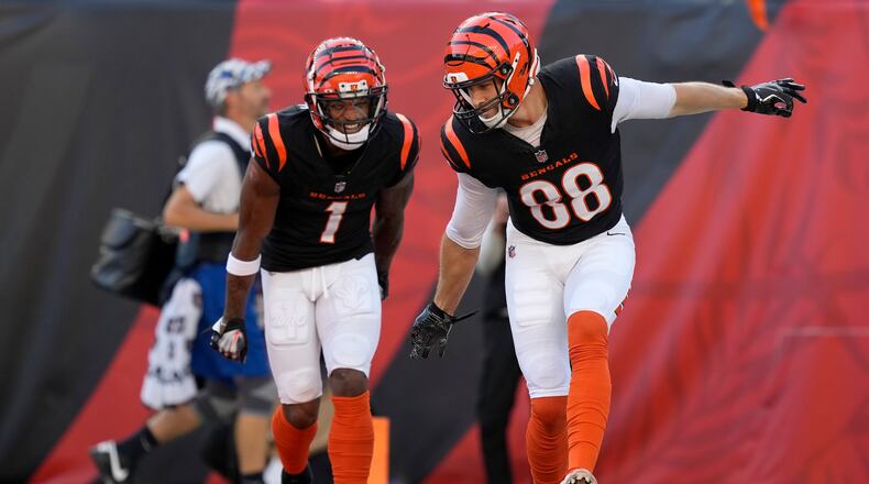 Cincinnati Bengals tight end Mike Gesicki (88) celebrates after scoring a touchdown with wide receiver Ja'Marr Chase (1) during the second half of an NFL football game against the Las Vegas Raiders in Cincinnati, Sunday, Nov. 3, 2024. (AP Photo/Carolyn Kaster)