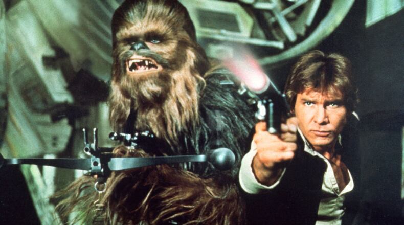 The city of Hamilton is leaning into the Star Wars Day frivolity by expanding the May the Fourth be with You movie night into a full-fledge hours-long festival and preceding Bar Wars cocktail contest. Pictured is Han Solo (played by Harrison Ford) with Chewbacca (Peter Mayhew) in “Star Wars.” CONTRIBUTED/FILE
