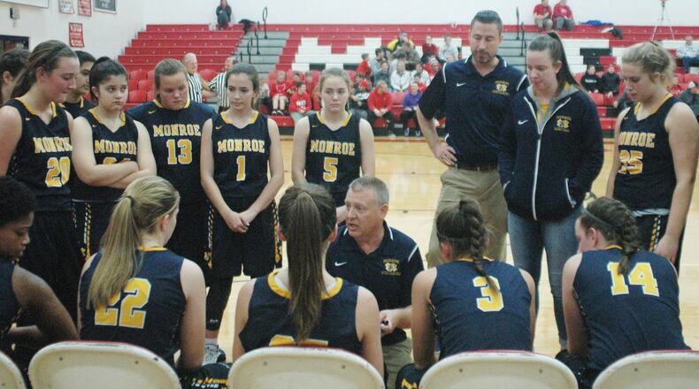 Monroe head coach Chad Allen talks to his team Nov. 29, 2018, at Madison. Chad Adolph (center, standing) was named as Allen’s replacement Monday night as he received school-board approval. RICK CASSANO/STAFF