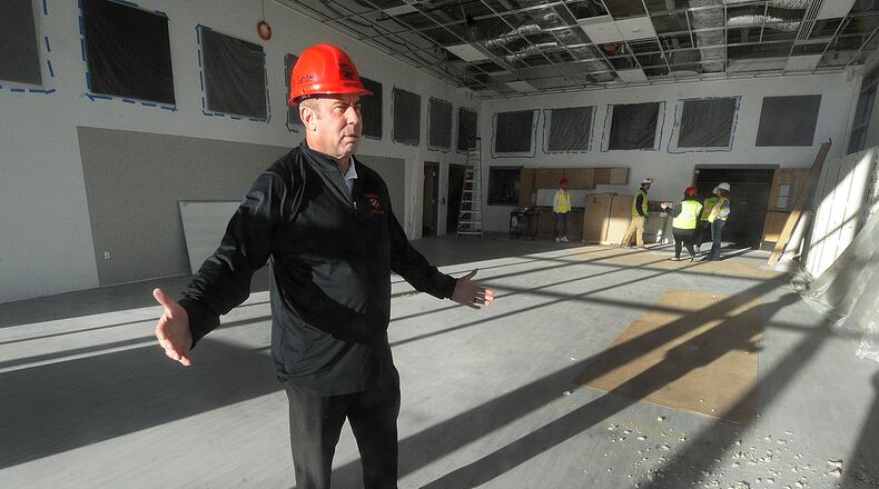 Superintendent Michael Sander talks about the natural light and the size of the band room at the new Franklin High School located on East Sixth Street. MARSHALL GORBY\STAFF