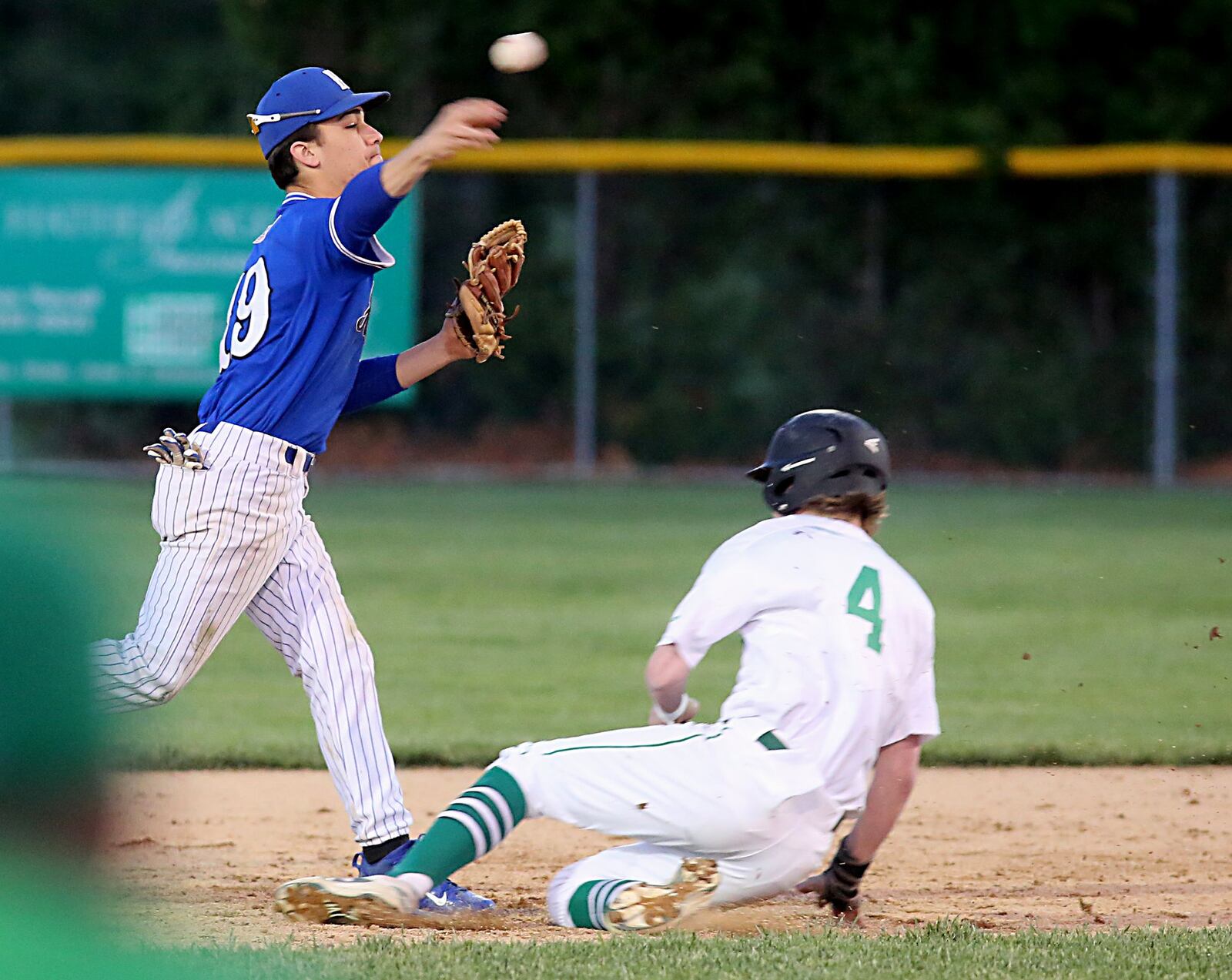 Badin’s Gavin Matthews is out at second base as Hamilton second baseman Cole Purdy turns a 6-4-3 double play Saturday night at Alumni Field in Hamilton. CONTRIBUTED PHOTO BY E.L. HUBBARD