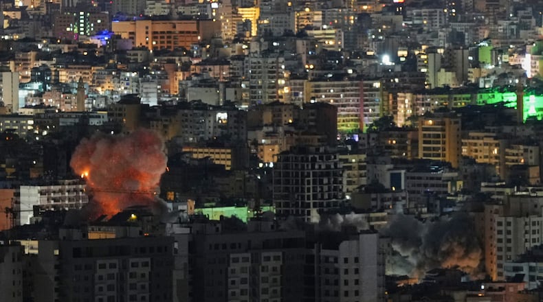 Smoke and flames rise from the site of Israeli airstrikes in Dahiyeh, Beirut's southern suburbs, Lebanon, Thursday, March 5, 2026. (AP Photo/Hassan Ammar)