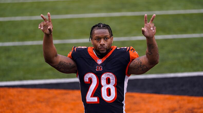 Cincinnati Bengals running back Joe Mixon (28) waves to fans as he leaves the field following a 33-25 win over the Jacksonville Jaguars in an NFL football game in Cincinnati, Sunday, Oct. 4, 2020. (AP Photo/Bryan Woolston)