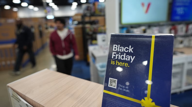 The National Retail Federation expects holiday sales to top $1 trillion for the first time, with 70% of consumers planning to make a purchase on Black Friday. (AP Photo/Gregory Bull)
