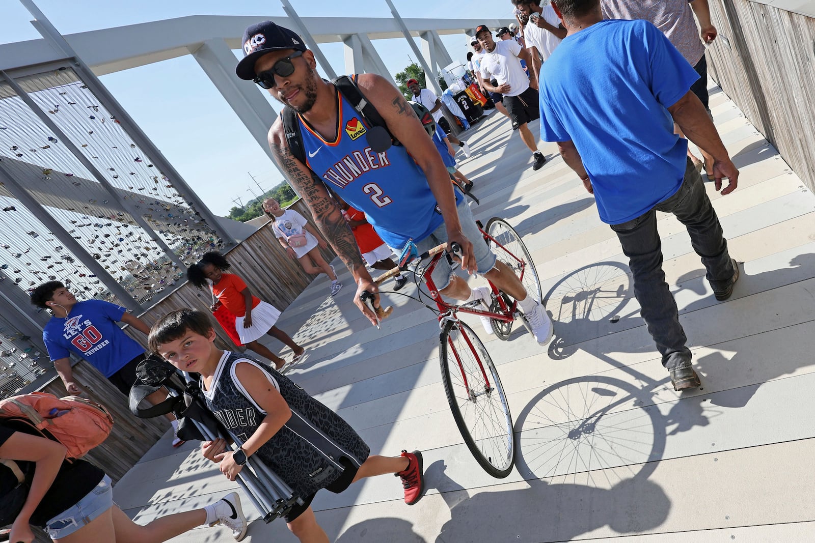 Fans make their way to the celebration of the Oklahoma City Thunder's NBA basketball championship Tuesday, June 24, 2025, in Oklahoma City. (AP Photo/Nate Billings)