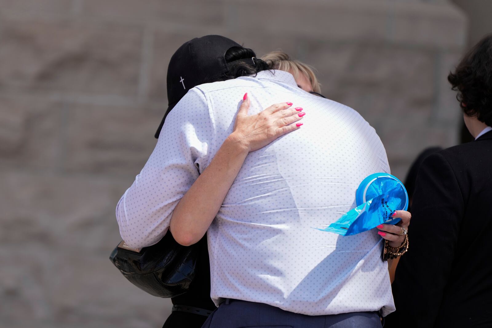 Father of Kaylee Goncalves, Steve Goncalves, hugs mother Kristi Goncalves after Bryan Kohberger's plea deal hearing on Wednesday, July 2, 2025, in Boise, Idaho. (AP Photo/Jenny Kane)