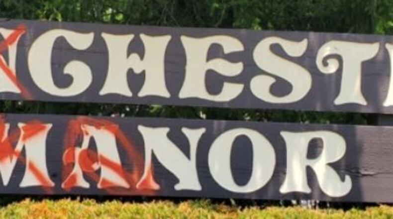 Someone vandalized at least one vehicle and the Manchester Manor sign last week in Middletown, according to police. Residents painted over the vandalism. SUBMITTED PHOTOS