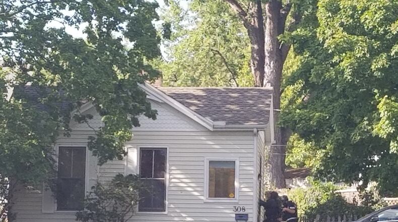 A SWAT team surrounded a Hamilton residence in the 300 block of Wayne Avenue shortly after 5 p.m. today. MICHAEL PURVES/STAFF