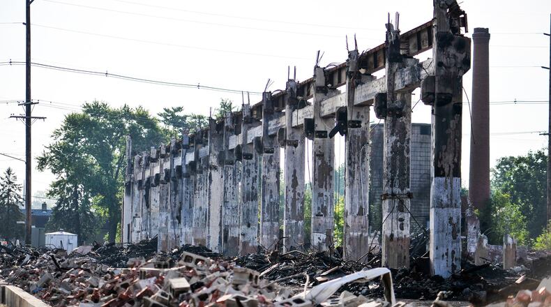 Crews from Vickers Demolition were still dismantling what was left in late August after a massive warehouse fire on Laurel in Hamilton. The fire started just before 5 a.m. Thursday, July 25, 2019. The city is still trying to recover the $186,000 demolition cost. NICK GRAHAM / STAFF