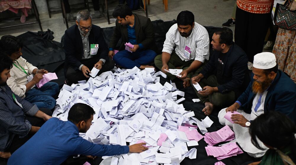 Polling officials begin the counting of votes cast in Bangladesh's national parliamentary election, in Dhaka, Bangladesh, Thursday, Feb. 12, 2026. (AP Photo/Mahmud Hossain Opu)