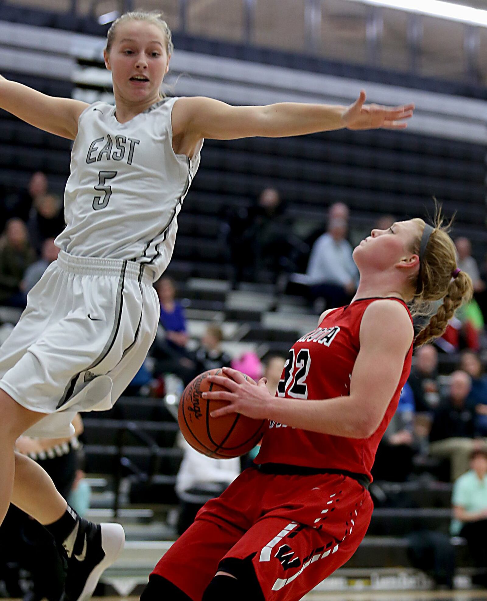 Lakota West guard/forward Abby Prohaska waits for Lakota East guard Caitlin Rolling to fly past before putting in two points during Wednesday night’s game at East. CONTRIBUTED PHOTO BY E.L. HUBBARD