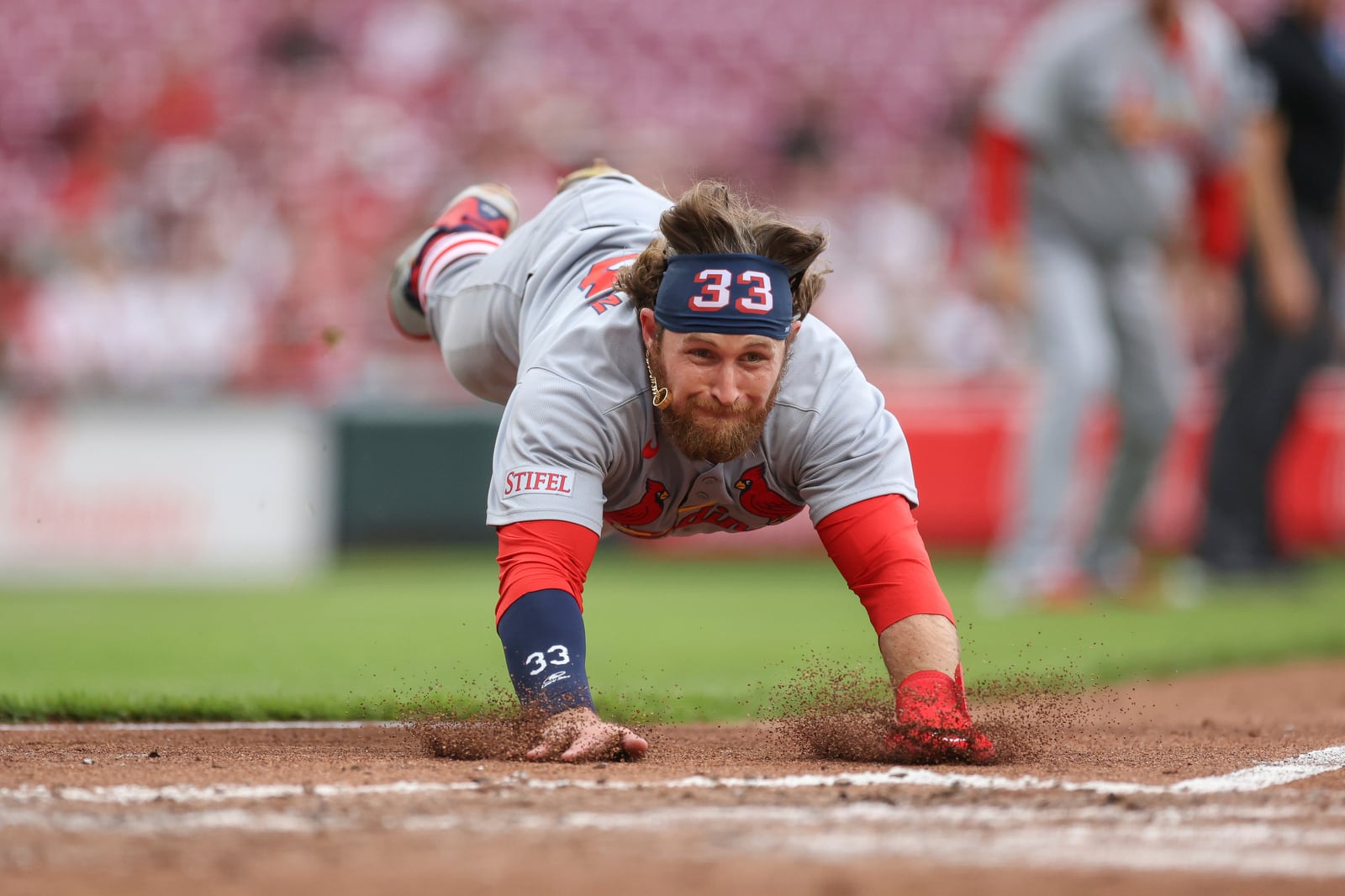 St. Louis Cardinals' Brendan Donovan scores on a fielding error by Cincinnati Reds shortstop Elly De La Cruz during the third inning of a baseball game, Thursday, May 1, 2025, in Cincinnati. (AP Photo/Abdoul Sow)