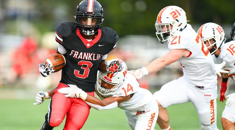 Franklin's Malachi Gipson (3) is tackled by Fenwick's Sean Heberling (14) during their season opener on Friday night at Franklin's Atrium Stadium. Kyle Hendrix/CONTRIBUTED