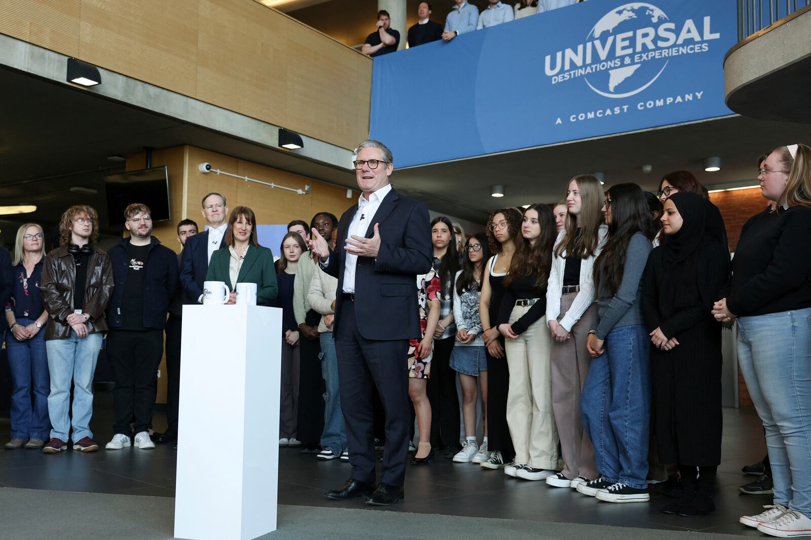 British Prime Minister Keir Starmer speaks next to Chancellor of the Exchequer Rachel Reeves at an announcement that U.S. media giant Comcast Corp will build its first Universal theme park and resort in Europe, opening in 2031, during a visit to Bedford, north of London, Wednesday April 9, 2025. (John Sibley/Pool Photo via AP)
