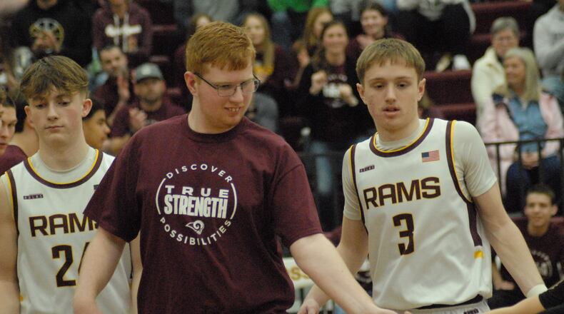 From left, Ross High School's Peyton Hendricks, Landon Ogborn, and Isaac Nunn were introduced before the Rams tipped off against Harrison Feb. 6 during True Strength Night. CONTRIBUTED