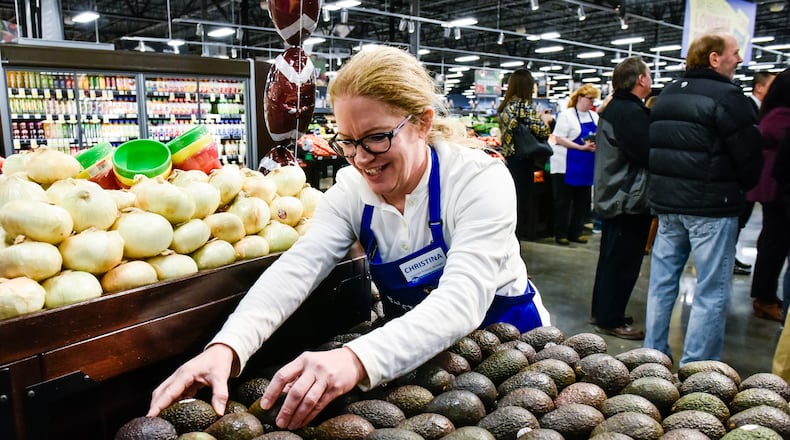 Go Green Hamilton has partnered with community organizations to conduct a food assessment survey to determine if the Hamilton population has access to fresh and healthy foods. Pictured in this Journal-News file photo is Christina Burkart organizing produce at the Kroger Marketplace at Crossings of Beckett on Princeton Glendale Road near Tylersville Road in West Chester Twp. NICK GRAHAM/FILE