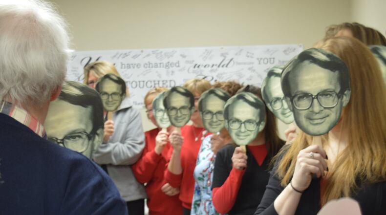 Dr. Terry Hunt was greeted with a roomful of well-wishers holding cutouts of his face as he entered during his retirement tour of McCullough-Hyde Memorial Hospital March 16, a day proclaimed Dr. Terry Hunt Day in Oxford by Mayor Kate Rousmaniere. CONTRIBUTED/BOB RATTERMAN