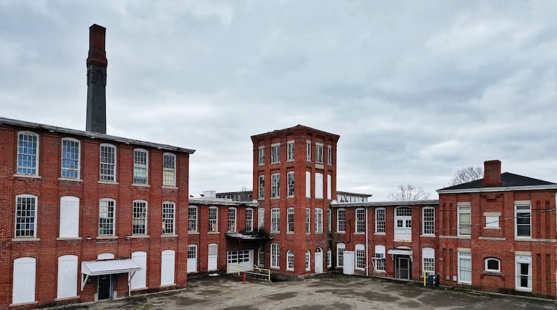 The $29 million Shuler & Benninghofen redevelopment project in the Hamilton neighborhood of Lindenwald is expected to receive historic tax credits this month. Owner Bloomfield Schon plans to invest $29 million to transform the building at the corner of Pleasant and Williams avenues ― just less than 2 miles from downtown Hamilton ― into a 100-plus-unit apartment complex with commercial space. NICK GRAHAM/FILE