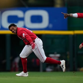Cincinnati Reds' Dane Myers, left, celebrates with Elly de la Cruz after hitting a single to score winning run in the eleventh inning of a baseball game against the Boston Red Sox in Cincinnati, Saturday, March 28, 2026. (AP Photo/Carolyn Kaster)