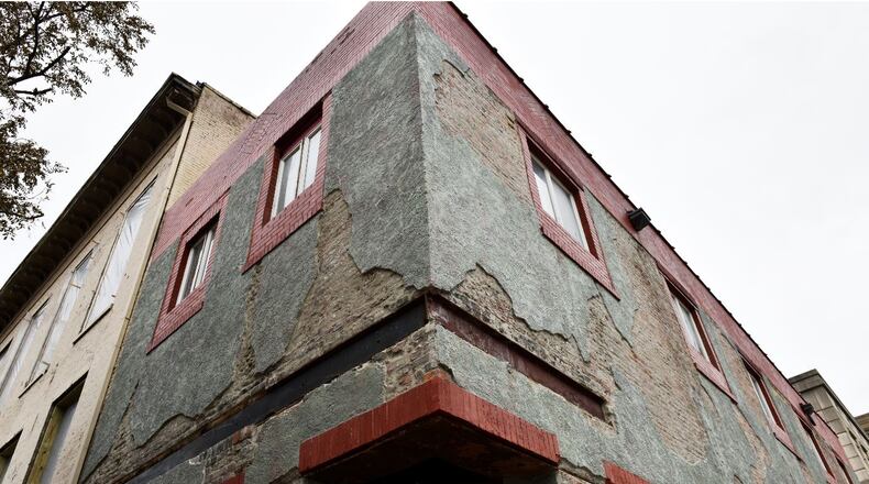 Two Hamilton buildings on South Third Street in downtown Hamilton are seeing a flurry of construction activity. One of them, at 20 S. Third St., will become a new restaurant and bar on the first floor with apartments above and the other building at 26 S. Third is set to become a 2-story bar. NICK GRAHAM/STAFF