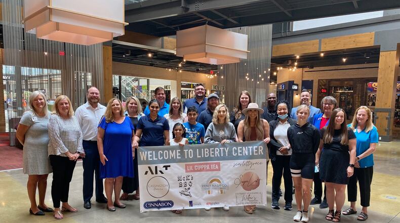 Delayed earlier this year by the coronavirus pandemic, Friday saw owners and representatives of nine businesses opened in the Liberty Center finally get their ribbon-cutting celebrations courtesy of a group celebrations put on the West Chester-Liberty Chamber Alliance. The business were part of a ribbon-cutting blitz at their Liberty Center location, say chamber officials. (Provided Photo\Journal-News.