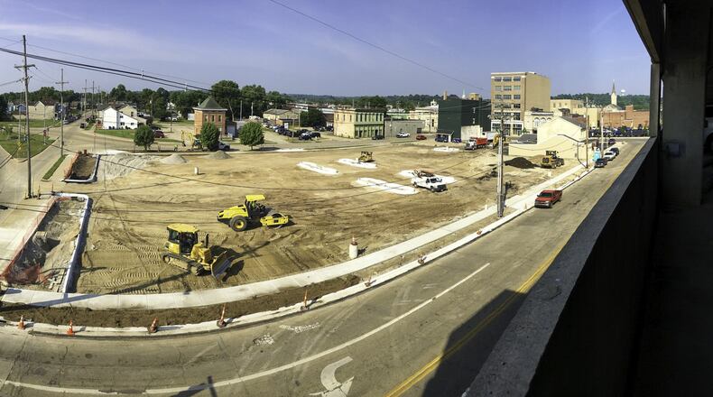 Hamilton is building a new parking lot behind Butler County’s parking garage adjacent to the county/city government complex, for the convenience of existing and future employers. GREG LYNCH / JOURNAL-NEWS