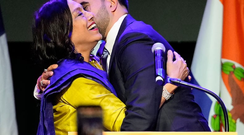 Mayor-elect Zohran Mamdani right, greets his mother Mira Nair, after making an acceptance speech, Tuesday, Nov. 4, 2025, in New York. (AP Photo/Yuki Iwamura)