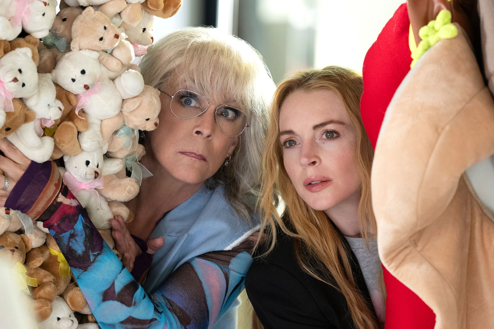 This image released by Disney shows Jamie Lee Curtis, left, and Lindsay Lohan in a scene from "Freakier Friday." (Glen Wilson/Disney via AP)