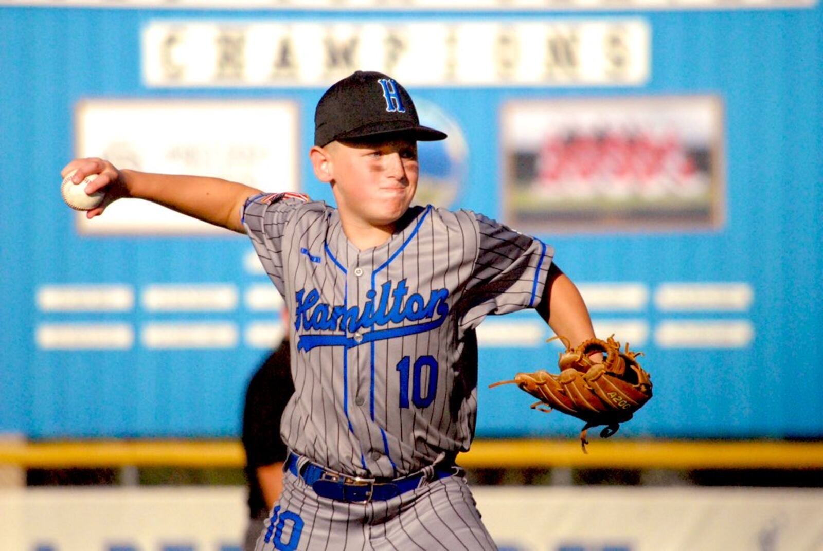 West Side's Eddie Frazier (10) prepares to send a pitch to the plate against Anderson Township on Wednesday night at West Side Little League. Chris Vogt/CONTRIBUTED