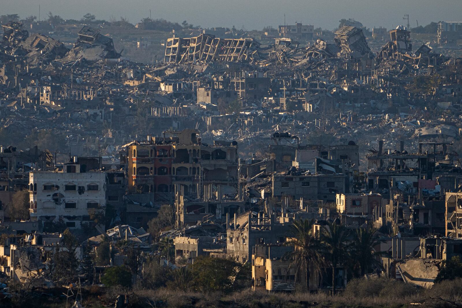 FILE - Destroyed buildings are seen inside the Gaza Strip from southern Israel, Jan. 13, 2025. (AP Photo/Ariel Schalit, File)