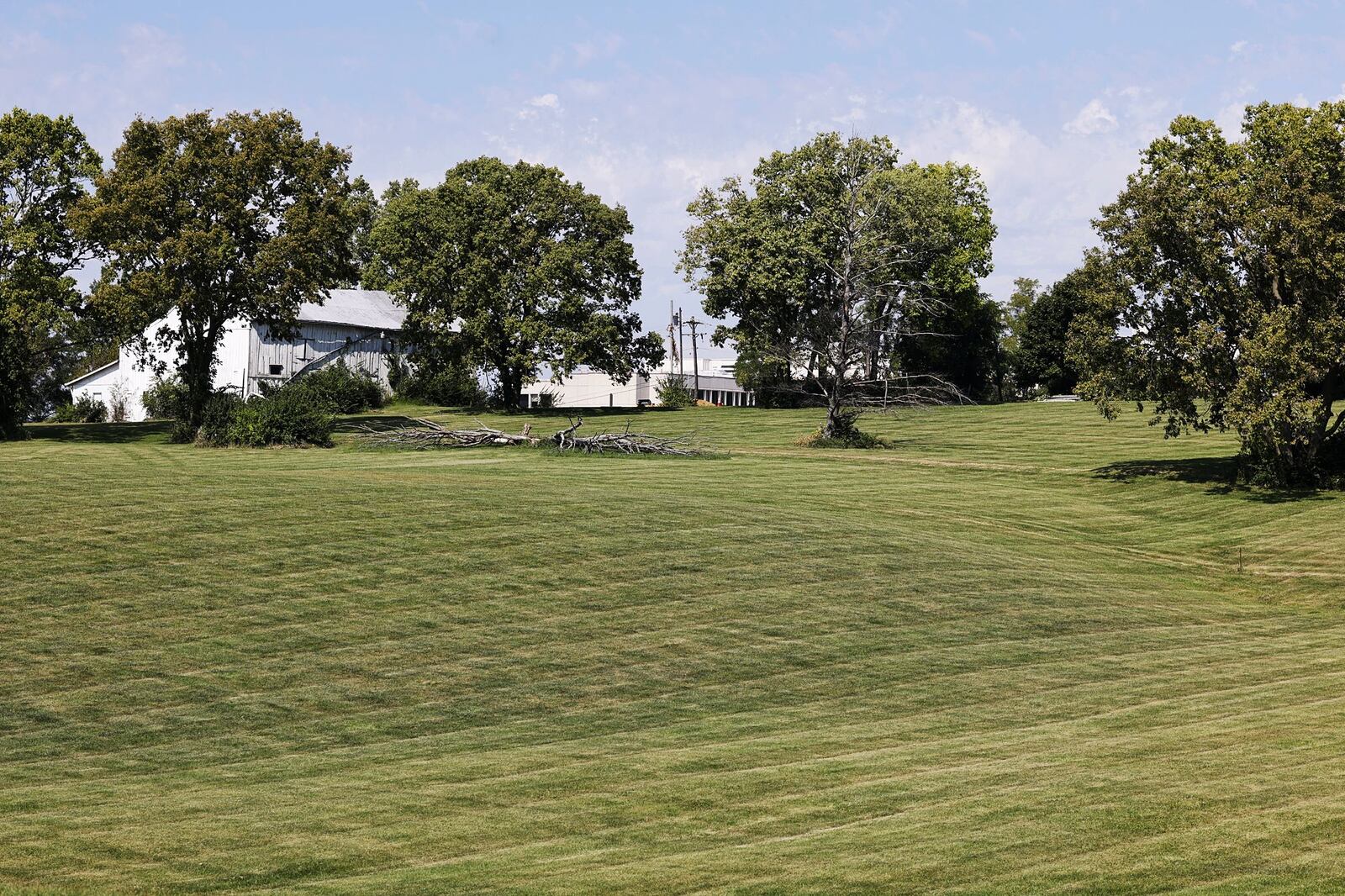 Cincinnati Financial Corp. had purchased the former Benzing Estate, which included the home, barn and silo. Cincinnati Financial purchased the home, intending to use the property for company purposes, but officials said it was beyond repair and razed the structures. NICK GRAHAM/STAFF
