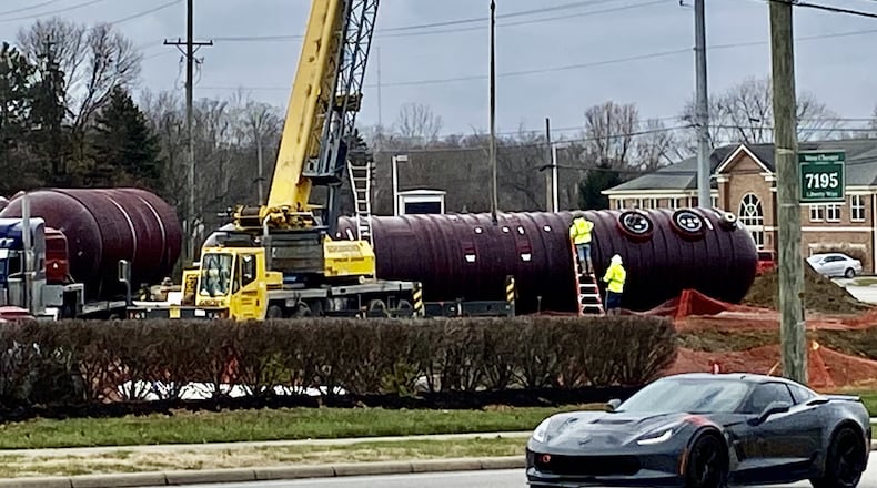 It’s a version of “store wars” now going on at a local intersection with home-town United Dairy Farmers (UDF) breaking into the lead so far against national chain Wawa’s first store in the region. Separated by Liberty Way at the eastern corners of the Cincinnati-Dayton Road intersection, the two convenience store chains both are building new stores at the high-profile location on the border of Butler County’s booming Liberty and West Chester townships. Workers recently installed UDF’s underground gas storage tanks at its site. (Photo By Michael D. Clark/Journal-News)