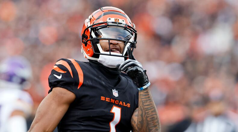 Cincinnati Bengals wide receiver Ja'Marr Chase (1) reacts after making a catch during the first half of an NFL football game against the Minnesota Vikings, Saturday, Dec. 16, 2023, in Cincinnati. (AP Photo/Jay LaPrete)