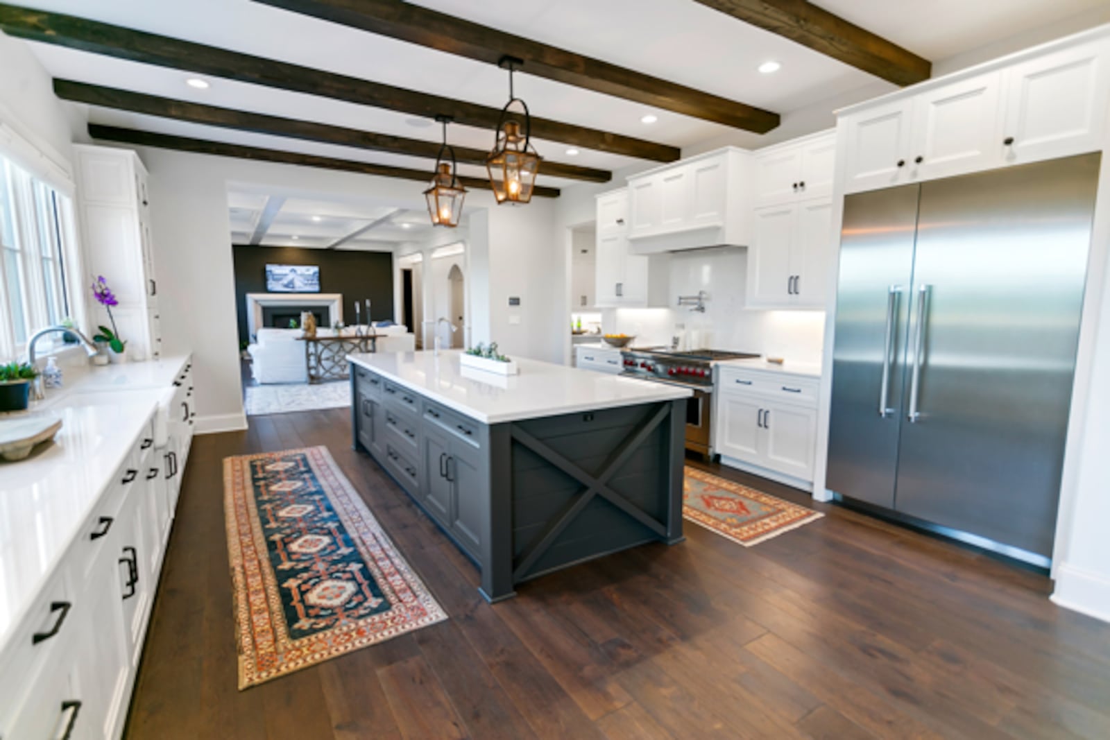 The chef's kitchen of the Bunnell Hill Road home pairs traditional elements like custom cabinetry with modern luxuries such as Wolf ranges and Cambria stone countertops. CONTRIBUTED