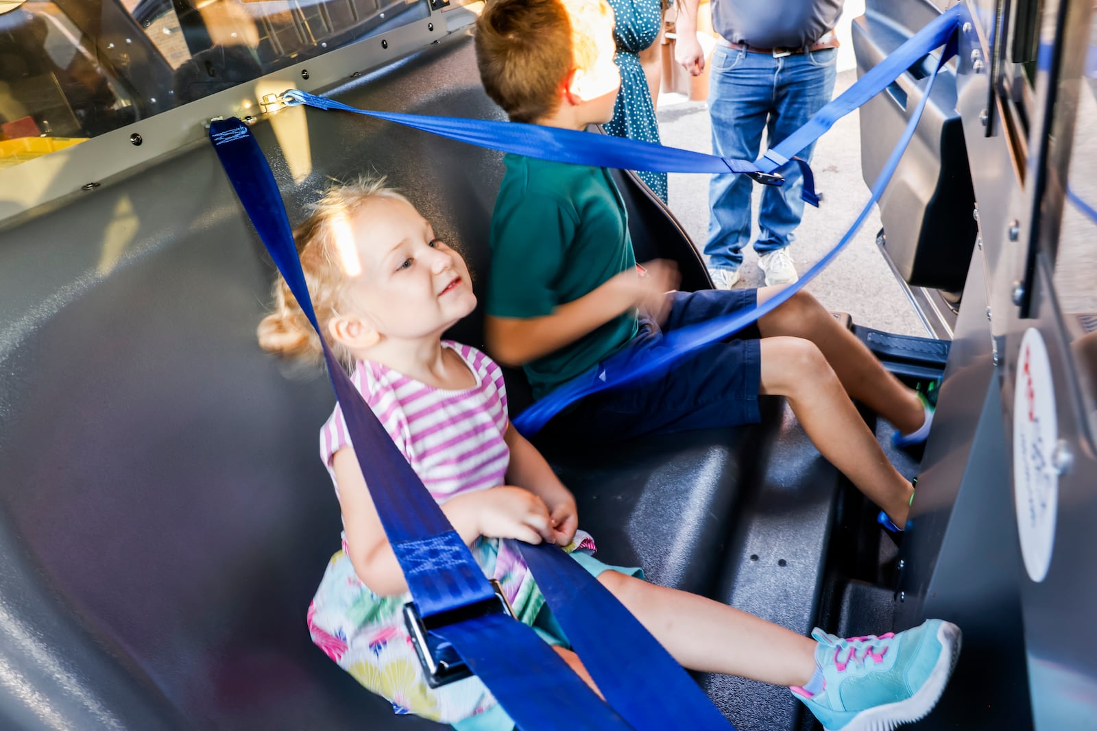 Lyla Kissel, 4, and Oliver Kissel, 9, sit in the back of a police vehicle during an open house of the new Hamilton police station Thursday, Sept. 25, 2025 in Hamilton.  NICK GRAHAM/STAFF