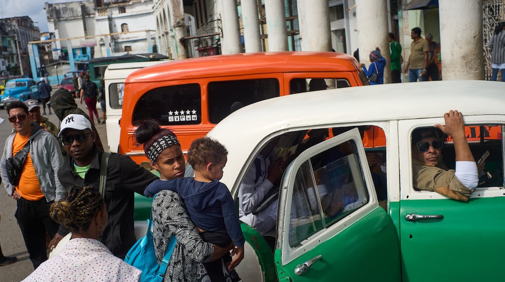 People wait their turns to board shared taxis in Havana, Cuba, Friday, Feb. 6, 2026. (AP Photo/Ramon Espinosa)