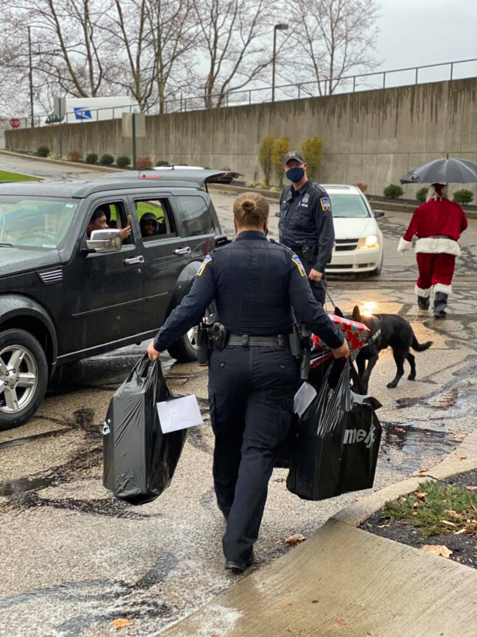 As part of its Mike Davis Shop with a Cop program, Middletown police officers and staff shopped for 24 local families with 62 children. The department held a drive-through gift distribution due to the coronavirus. SUBMITTED PHOTO