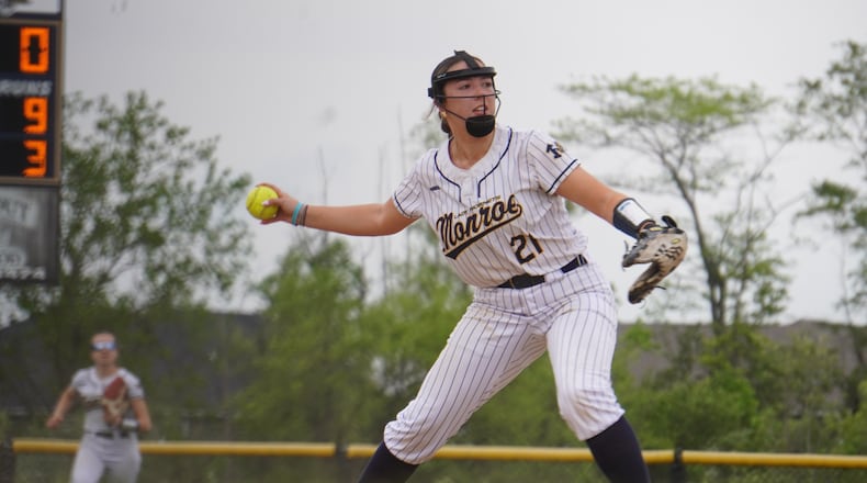 Monroe senior third baseman Molly Griffin prepares to make a throw to first base during her Division III tournament game against Mercy McAuley on Friday. CHRIS VOGT / CONTRIBUTED